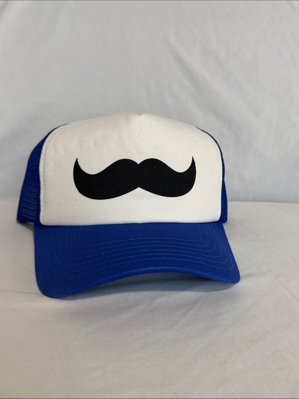 Blue and White Trucker Hat with Black Mustache Graphic